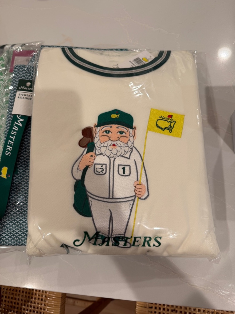 Masters Cream Graphic Caddy Tee with Green Cap and Yellow Flag